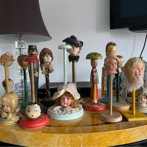 Antique doll head hat stands